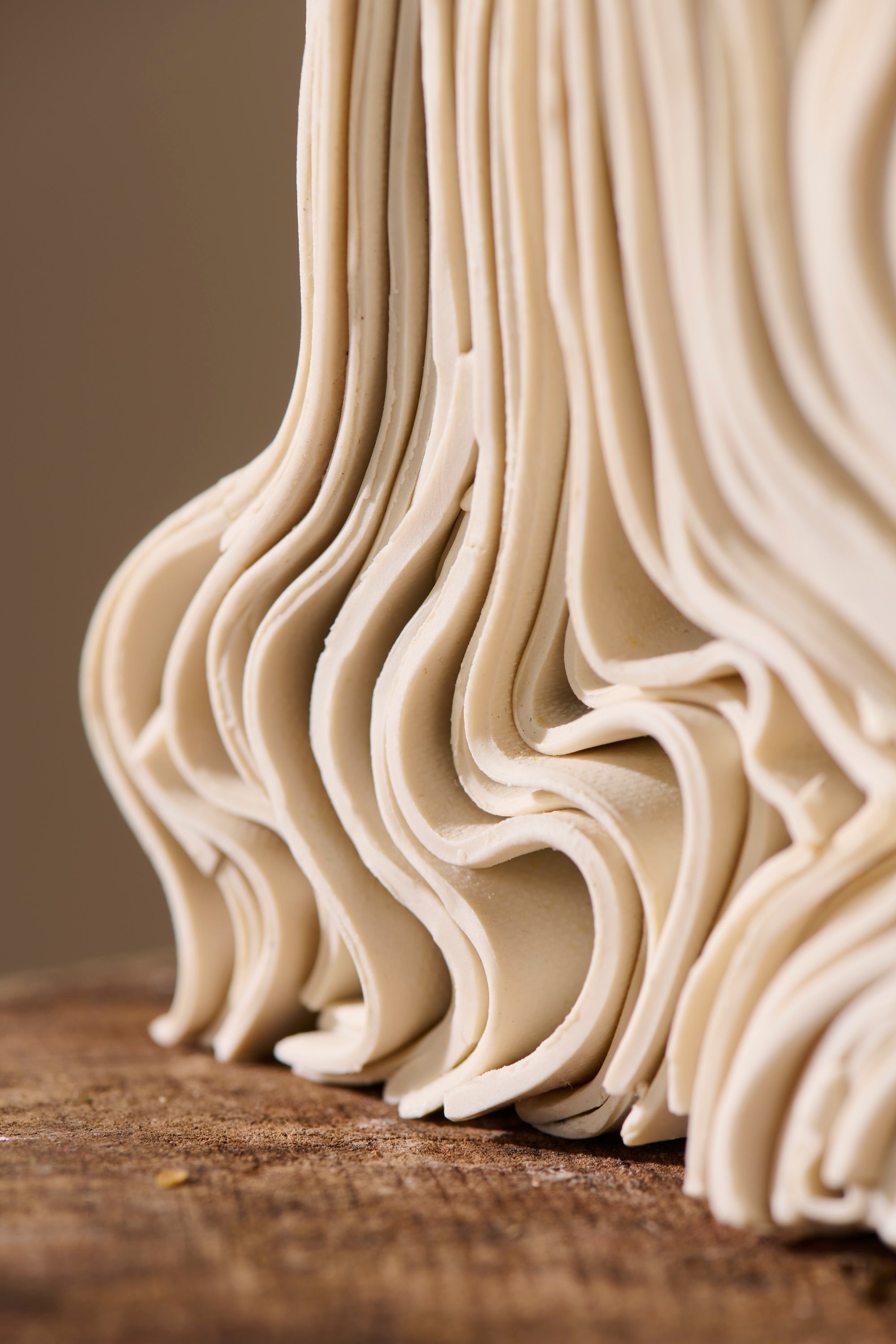 Close-up of Stack 41 porcelain sculpture showing unglazed ceramic layers with subtle texture and organic variation created by hand.