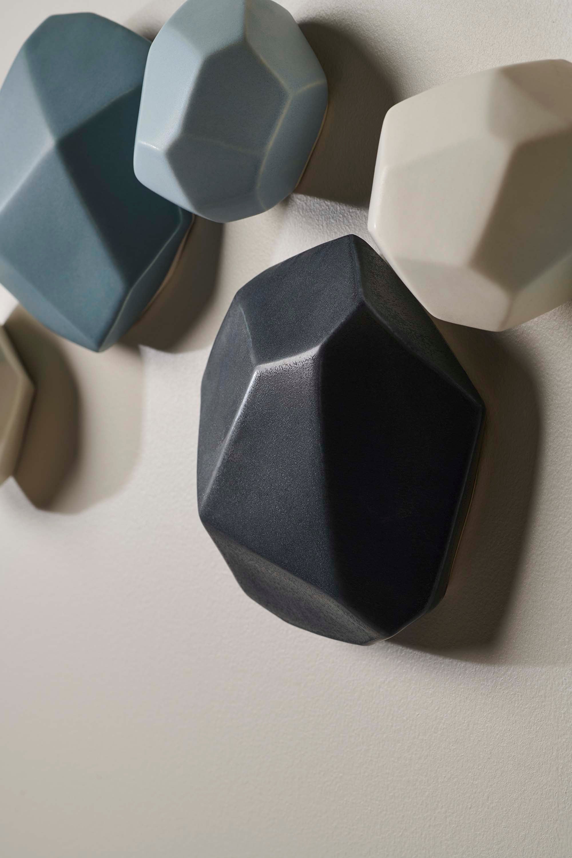 Close-up showing the matte and gloss mix of the hand-glazed stones, revealing texture and variation in tone.